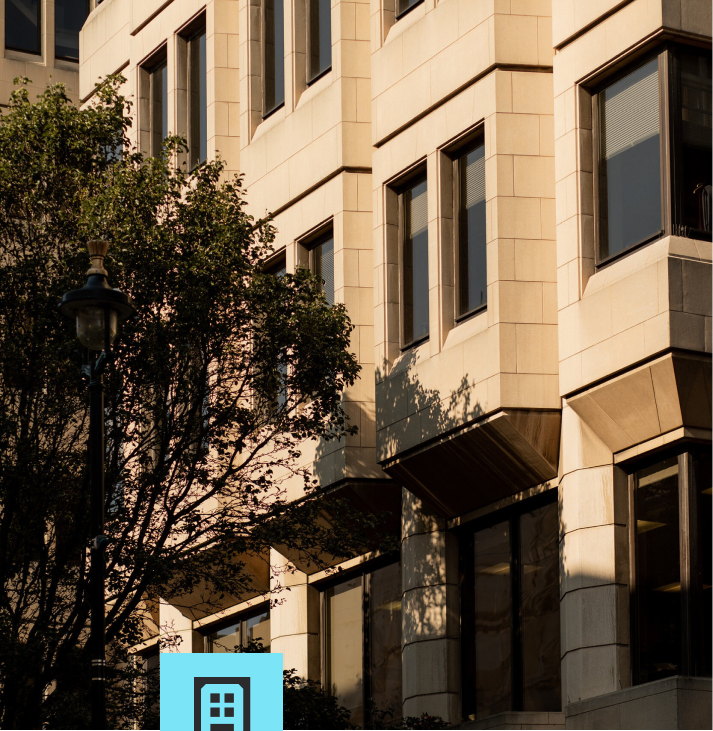 Sandstone apartment building facade in late afternoon light